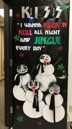 a door decorated with snowmen and sayings for the holiday season in front of a building