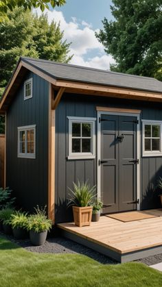 a small shed with two doors on the front and one door open to let in light