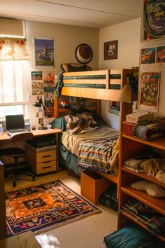 a bedroom with bunk beds and desks in it