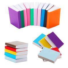 several different colored books are stacked on top of each other, with one book in the middle