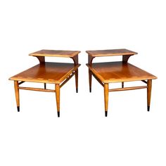 a pair of wooden tables sitting on top of each other