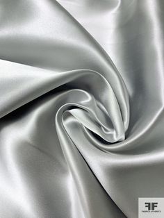 SKU: 16108 Content: 100% Silk Color: Light Grey Width: 40 inches Silk Fabric Texture, Beauty Salon Uniform Ideas, Satin Fabric Texture, Grey Fabric Texture, Silver Color Palette, Salon Uniform, Satin Curtains, Colors Outfit, Silk Texture