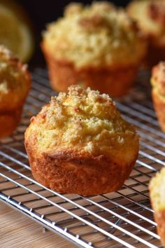 lemon ricotta muffins on a cooling rack with the title overlay reads, lemon ricotta muffins