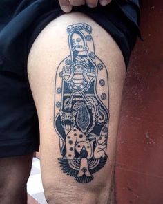 a person with a tattoo on their thigh