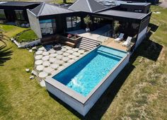 an aerial view of a house with a swimming pool