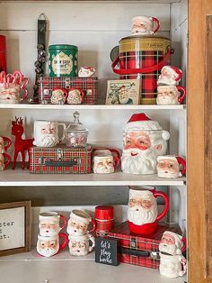 santa claus mugs and other christmas decorations on shelves