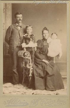 an old time photo of a family posing for a picture