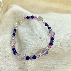 As a bisexual Libra myself, I couldn't decide if I wanted to use light pink or dark pink Swarovski crystals so I used both. This bracelet is of course designed using the bisexual pride colors. I used amethyst, lapis lazuli, and pink and blue Swarovski crystals with solid sterling silver elements. It is 7.5 inches long.  **The Pride collection is made to order.** Please allow 2-3 business days for shipping. Sterling Silver will develop a natural patina over time which can be cleaned off. This pat Bisexual Bracelet, Bisexual Jewelry, Bisexual Pride Flag, Pride Collection, Pride Colors, Sterling Silver Bead Bracelet, Bracelets Design, Pink Swarovski, Beads Bracelet Design