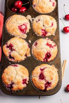 fresh cherry muffins in a muffin tin ready to be eaten