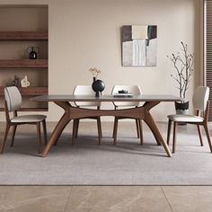 a dining room table with chairs around it