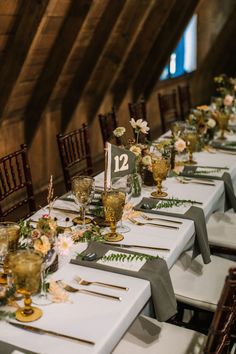 the table is set with place settings for guests