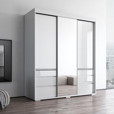 an empty room with white and grey furniture