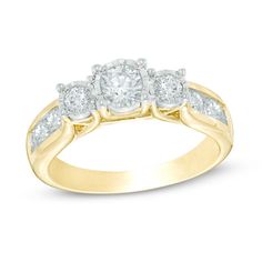 three stone diamond ring in yellow gold