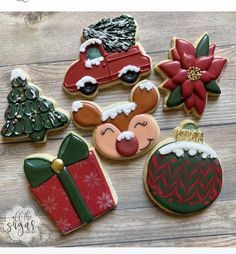 decorated christmas cookies on a wooden table