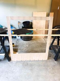 an unfinished mirror frame in the process of being built