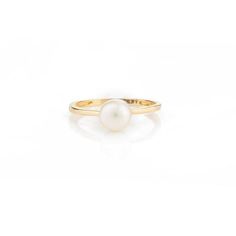 This is part of Chairish’s Fine Jewelry assortment.  Elegant Natural Pearl Solitaire Ring in 18K Gold featuring natural pearl of 1.7 carats. The gorgeous handcrafted ring goes with every style. Pearl symbolizes purity, determination and perfection.  Designed with a round cut pearl set in center of the ring that makes it a perfect fit to wear it on your occasion or style it with any of your basic outfit to give it a glam. This is a perfect Solitaire Pearl Ring. It can be a Bridal Shower Gift, Rin Classic Pearl Drop Ring, Classic Round Pearl Ring With Pearl Drop, Classic Pearl Ring With Pearl Drop, Classic Yellow Gold Rings With Pearl Drop, Timeless White Gold Pearl Ring With Round Band, Timeless Pearl Ring With Round Band, Classic Yellow Gold Pearl Ring With Round Band, Classic Yellow Gold Pearl Rings, Timeless Yellow Gold Pearl Promise Ring