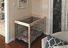 a dog cage in the corner of a living room