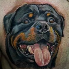 a close up of a mans chest with a large dog's face on it