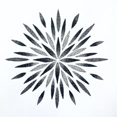 a black and white drawing of a starburst with many small dots in the center