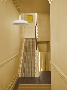 an image of a stairway and wallpaper on the cover of farrow & ball magazine