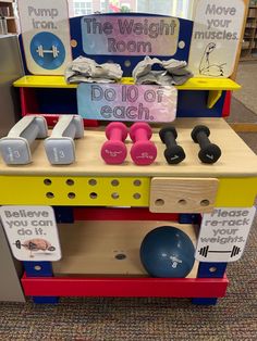 a child's play room with toys and signs on the shelves that read, the weight room dolo of each