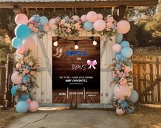 an arch decorated with balloons and flowers for a baby shower