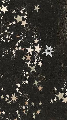 the stars are falling from the sky in black and gold colors, as well as white dots