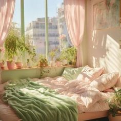 an unmade bed in front of a window with pink curtains and potted plants