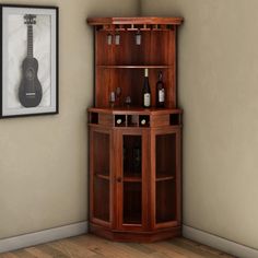 a corner cabinet with a guitar on the wall