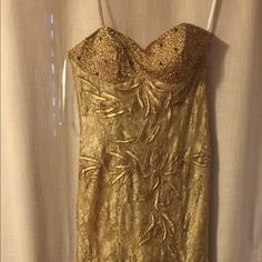 Beautiful Nwt Long Golden Gown Purchased For A Wedding - Has Removable Spaghetti Straps Intricate Lace & Some Bedding Zoom In To See Details Zipper Back Satin Lined - One Strap Does Not Have The Hook Can Easily Be Replaced Size Large But Would Fit A Medium Too Was My Backup Dress To A Wedding Vintage Gold Dress, Gold Fitted Gown With Sweetheart Neckline, Gold Lace Prom Gown, Fitted Gold Floor-length Wedding Dress, Formal Strapless Gown With Lace Bodice, Gold Fitted Floor-length Wedding Dress, Gold Mother Of The Bride Dress With Sweep Train, Gold Lace Wedding Gown, Gold Lace Floor-length Evening Dress