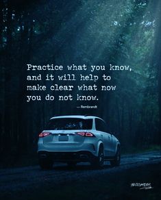 a car parked in the middle of a forest with a quote on it