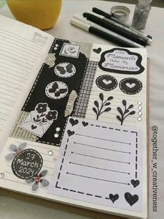 an open notebook with some stickers on it