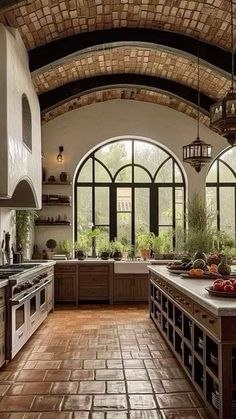 a large kitchen with an arched ceiling and tile flooring