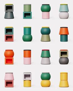 an assortment of different colored vases sitting next to each other