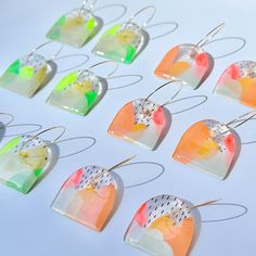 Our one-of-a-kind resin earrings are handcrafted with love using high-quality acrylic paints and resin. The bold neon colors and glossy finish create a truly eye-catching piece. Each pair is unique, making it the perfect addition to any jewelry collection. - Handmade by owner in Los Angeles - Acrylic painted - Resin finish - 18K gold plated hoop 1" Watercolor Resin Jewelry, Small Hoop Resin Earrings For Gifts, Small Hoop Resin Earrings Gift, Resin Small Hoop Earrings For Gift, Handmade Resin Hoop Earrings For Gifts, Handmade Clear Earrings For Everyday, Handmade Resin Hoop Earrings As Gift, Clear Small Hoop Earrings As Gift, Handmade Clear Hoop Earrings For Gift