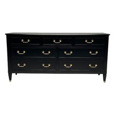 a black dresser with gold handles and drawers