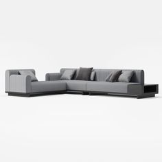 a gray couch with pillows on top of it