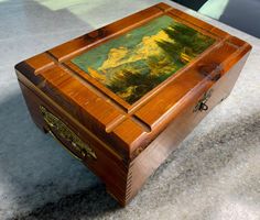 an open wooden box sitting on top of a table