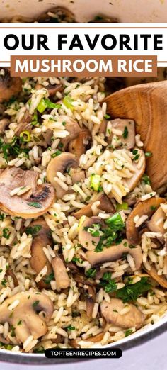 mushroom rice in a pan with wooden spoons