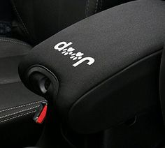 the interior of a car with black seats and white stitching