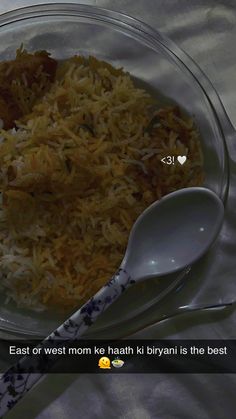 a glass bowl filled with rice and meat