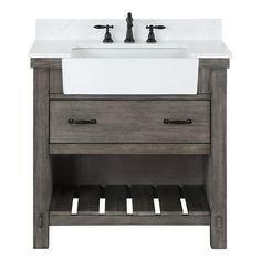 Crafted from richly grained solid hardwood, our Villareal Vanity Series blends traditional farmhouse design elements with the cool, contemporary look of natural stone. Youll love the rustic details woven throughout this piece, from the barn door-inspired cabinet sides to the wooden slats on the lower open shelving. With its gorgeous medley of textures and tones, the Villareal will be the showpiece of your guest or master bath. Features : Constructed of imported solid oak and plywood for superior Bathroom Vanity Furniture, Vanity Furniture, 36 Inch Bathroom Vanity, Farmhouse Bathroom Design, Basin Bathroom, Farmhouse Bathroom Vanity, Wood Bathroom Vanity, Wooden Vanity, Bathroom Furniture Vanity