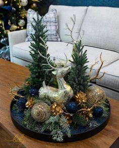 a living room with christmas decorations on the coffee table