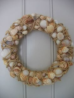 a wreath made out of rope with seashells on it