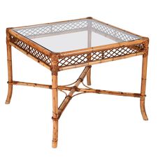 a table with glass top and bamboo frame