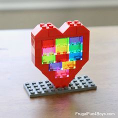 a heart made out of legos sitting on top of a table