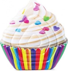 a cupcake with white frosting and rainbow sprinkles on it's wrapper