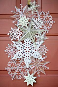 an ornament hanging from the side of a door with snowflakes on it