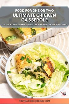 a white bowl filled with chicken and lettuce next to a pan of food