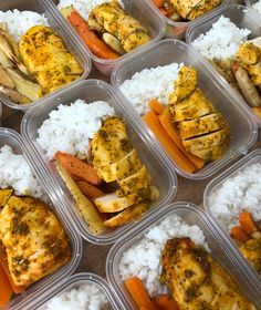 several plastic containers filled with chicken, carrots and rice